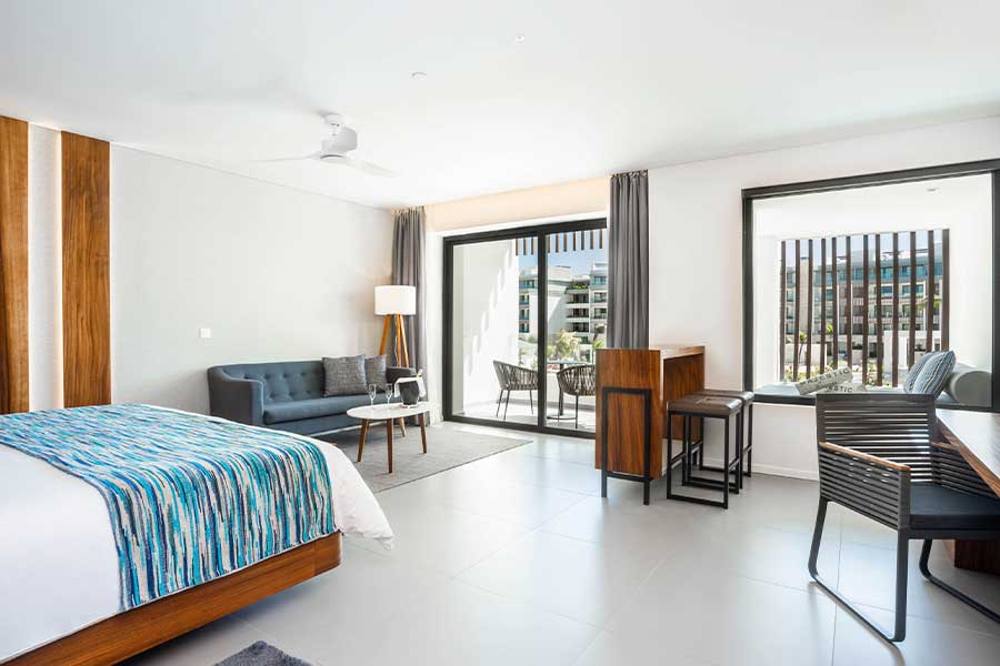 dormitorio y zona de estar elegance club junior suite