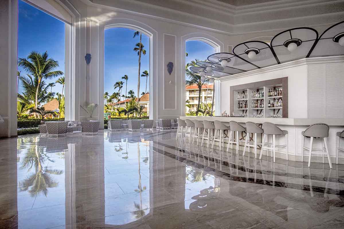 Elegant lounge with views of the Lobby Bar at Majestic Mirage Punta Cana Hotel